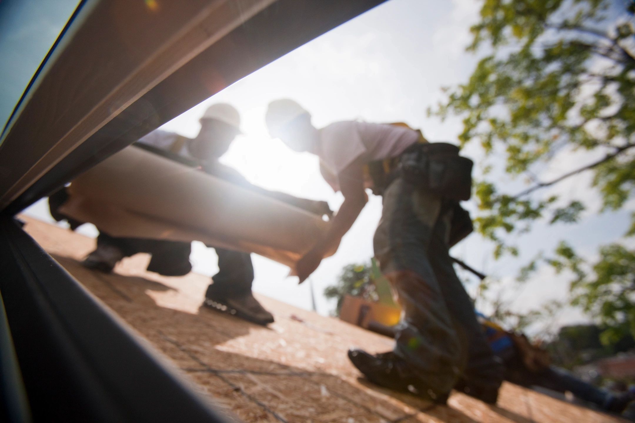 professional roofers installing a new roof - professional roofing contractor